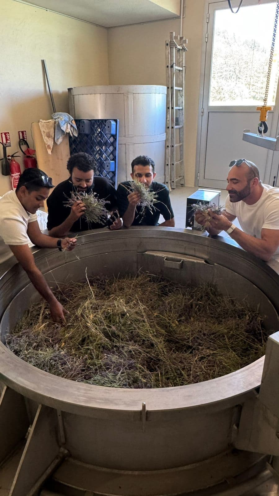 Ahmed Al Hassoni visiting a fragrance distillation unit in the South of France — perfumery training