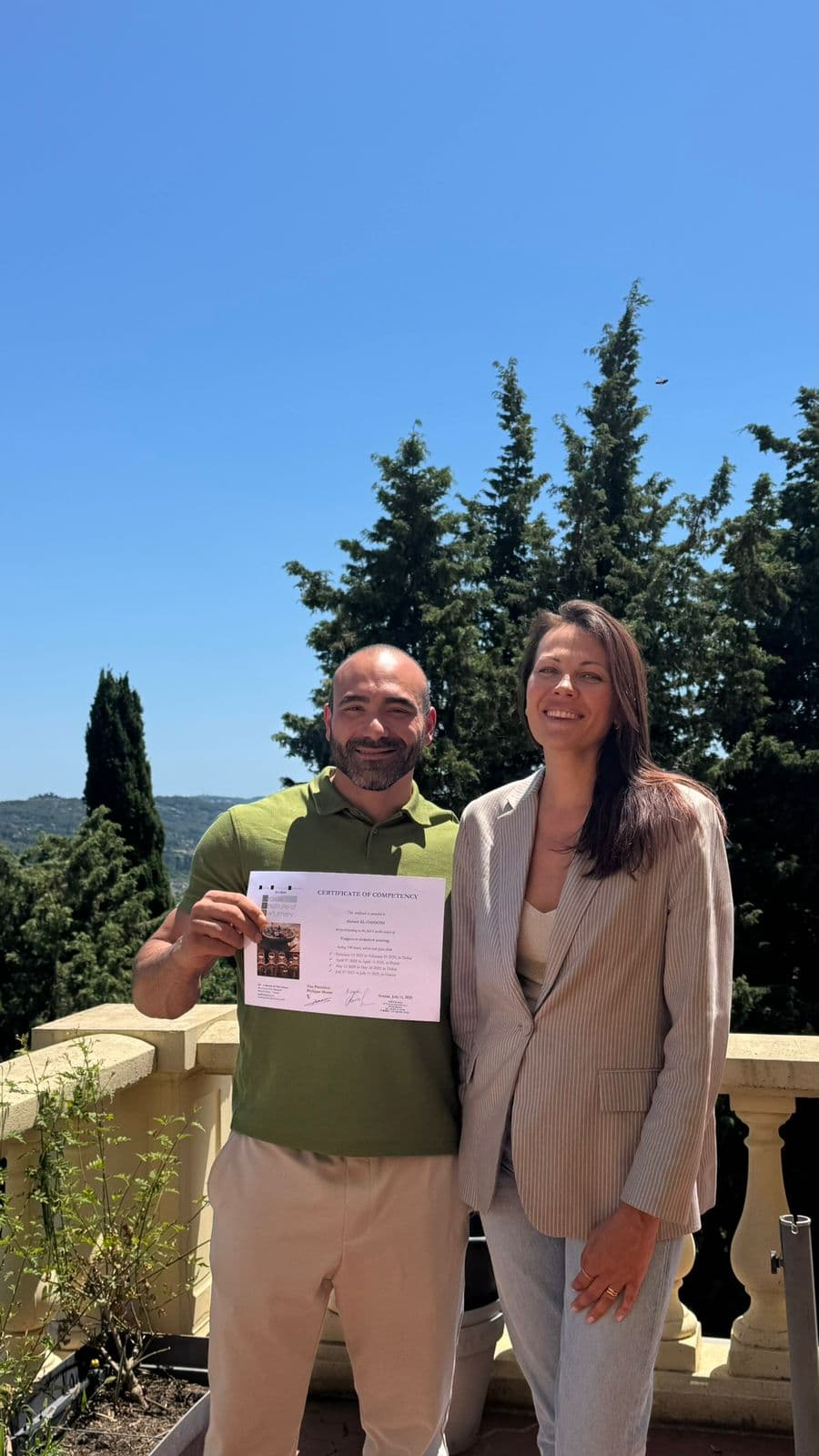 Ahmed Al Hassoni with his perfumer certificate from Grasse, France